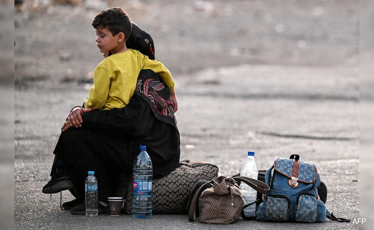 Lebanese Take Refuge In Shelters After Long Trips Fleeing Israeli Bombing