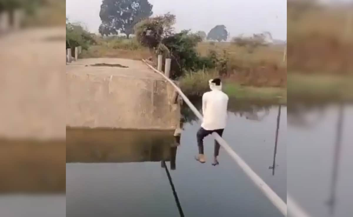 Read more about the article After Bridge Collapse, Man Uses Pipe To Cross Stream In Telangana