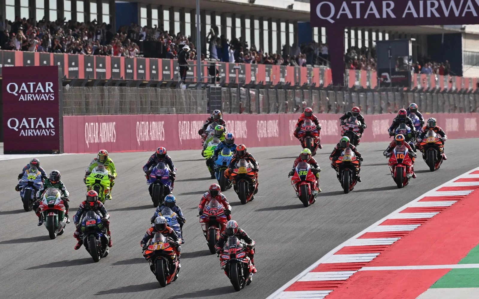 Riders approaching a corner at the 2025 Portuguese MotoGP