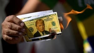 Read more about the article Dollar hovers near four-year low as Trump comments fuel sell-off ahead of Fed decision – Firstpost