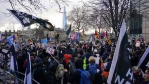 Read more about the article Opposition protests Beijing’s ‘mega embassy’ as decision deadline looms – Firstpost