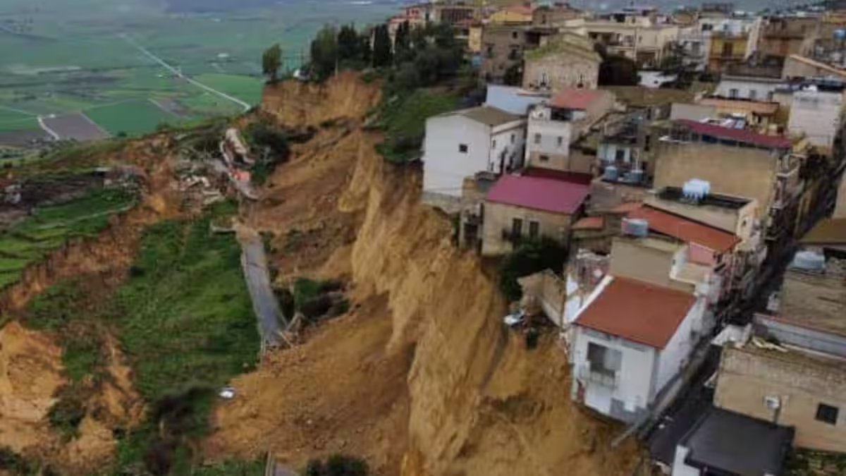 Houses atop hill collapse one after another after major landslide slams town in Italy